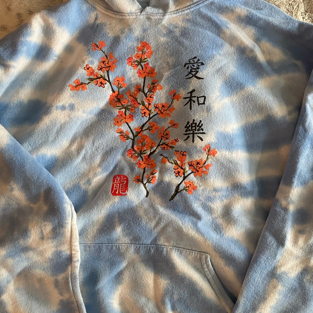 Sky blue tie dye hoodie with graphic